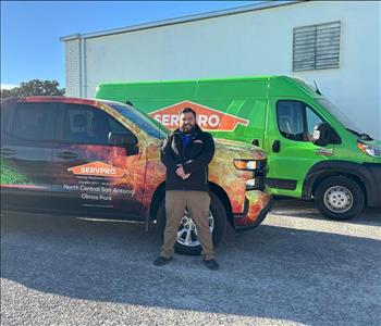 Man standing in front of a SERVPRO truck